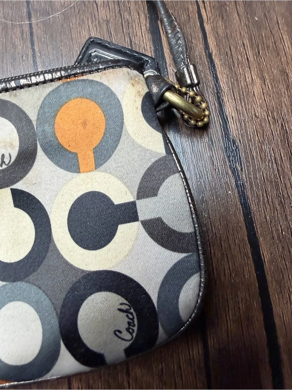 Coach Madison Graphic Op Art sateen Wristlet in Brown and Orange Accents